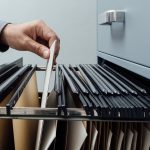 Office Clerk Searching For Files